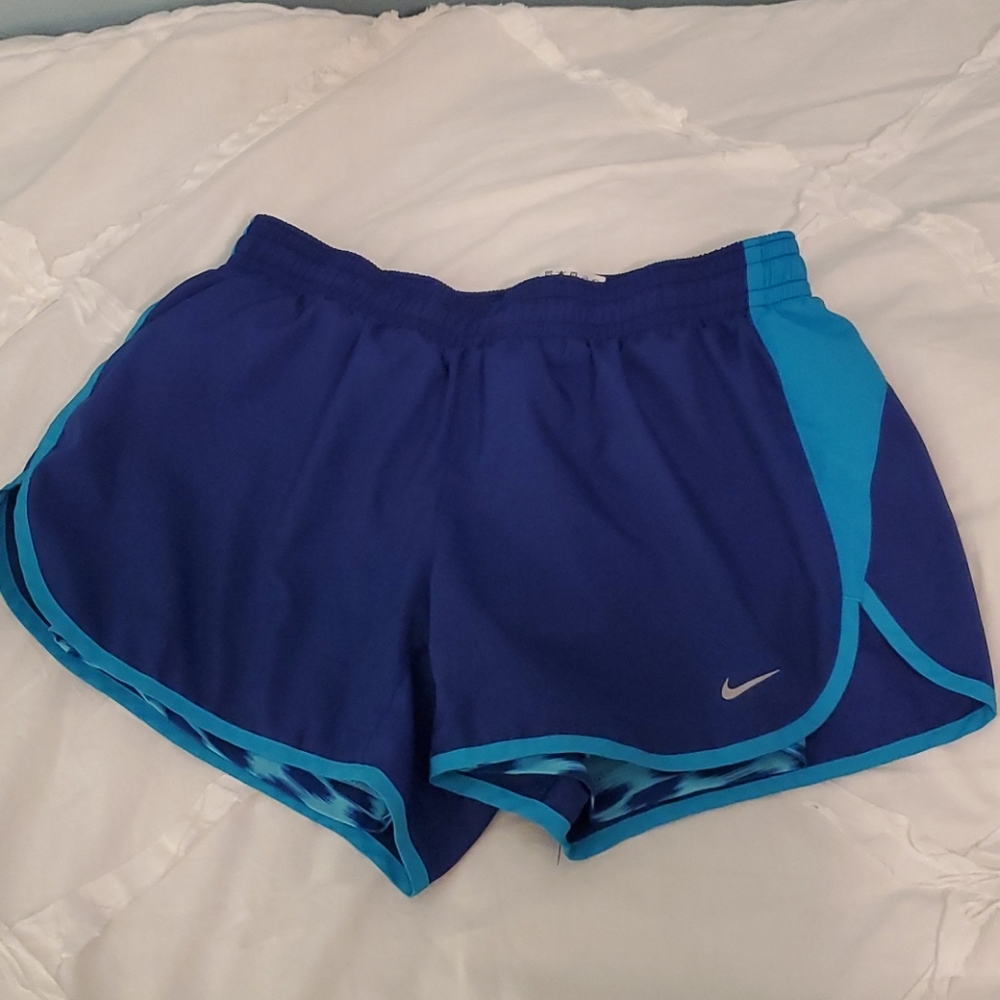 Blue Nike running shorts